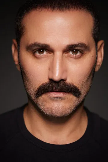 Фотография актёра Дженгиз Окуюджу